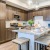 a kitchen with a bar stool and a table