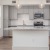 a kitchen with white cabinets